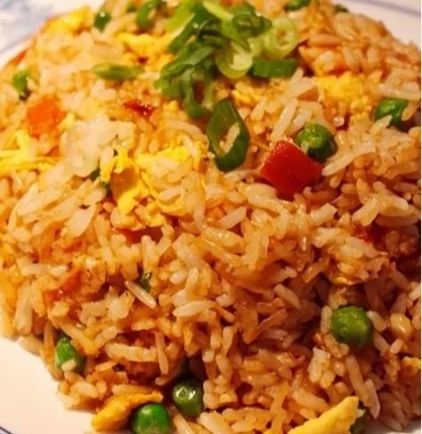 A delicious bowl of easy egg fried rice loaded with vegetables and eggs.
