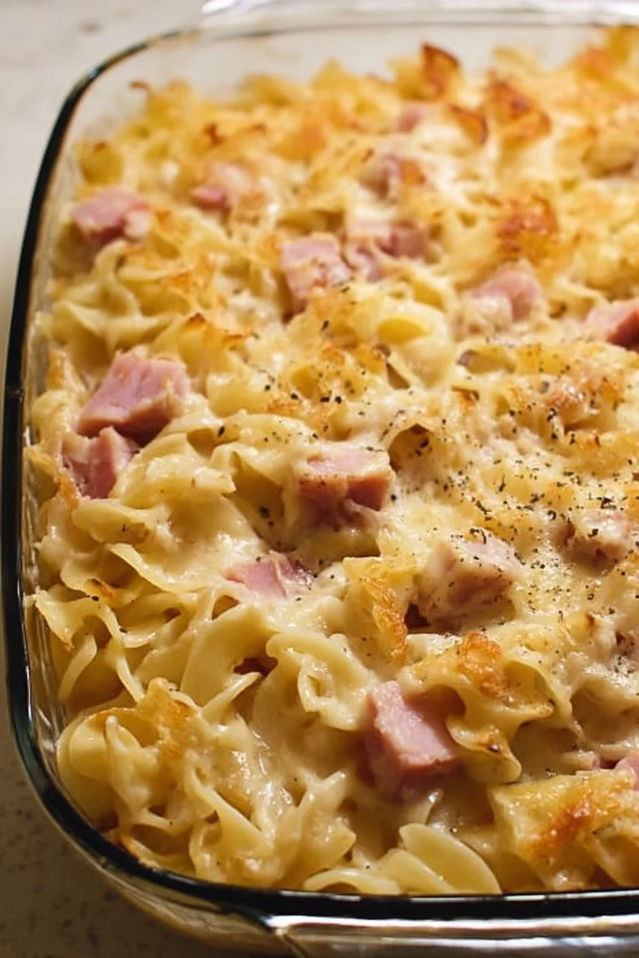 Comforting Leftover Ham Noodle Casserole 5 Comforting leftover ham noodle casserole topped with cheese and herbs.