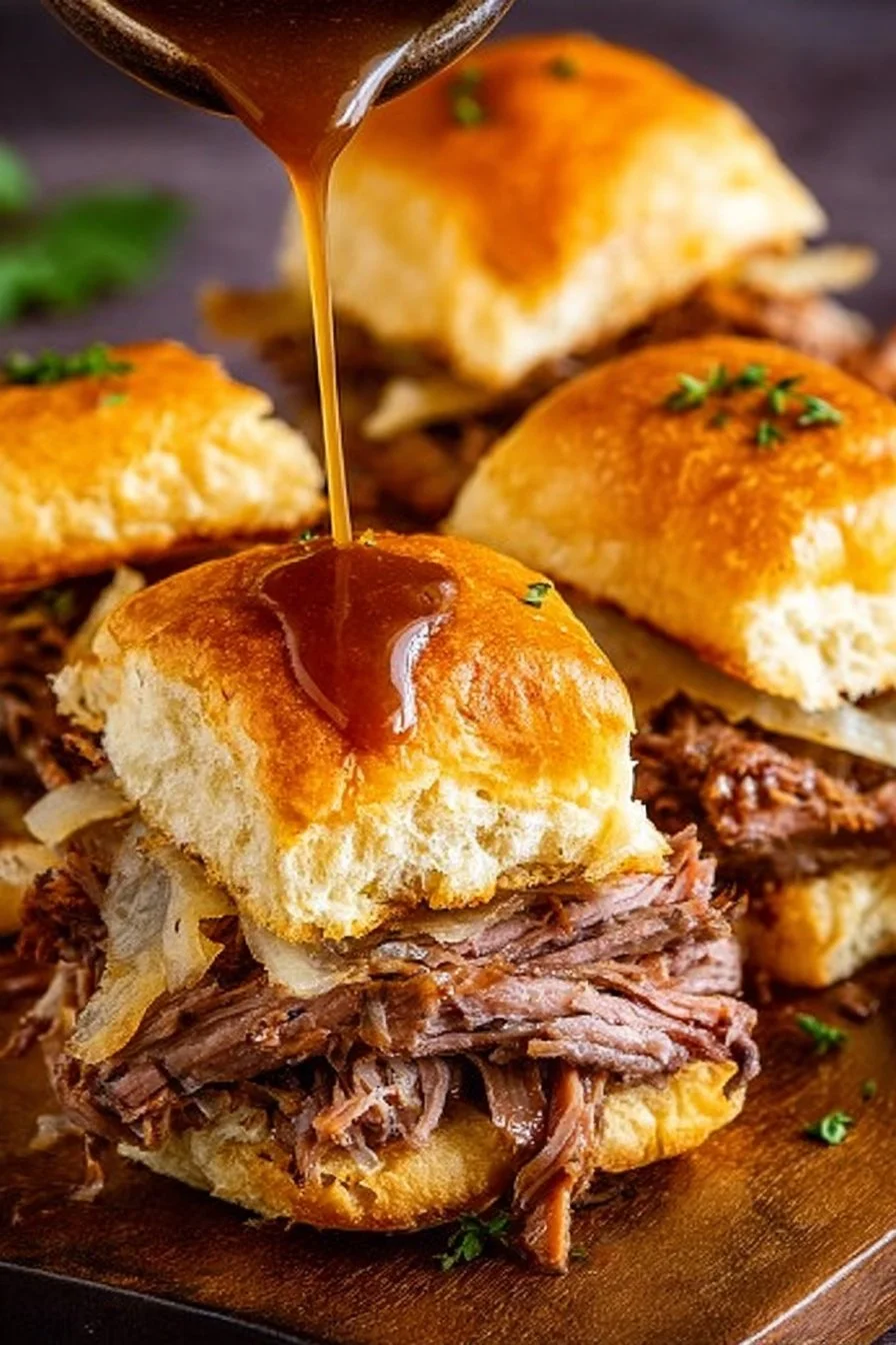 Delicious French Dip Sliders served with savory dipping sauce
