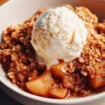 Delicious homemade apple crisp dessert topped with crispy oats and cinnamon