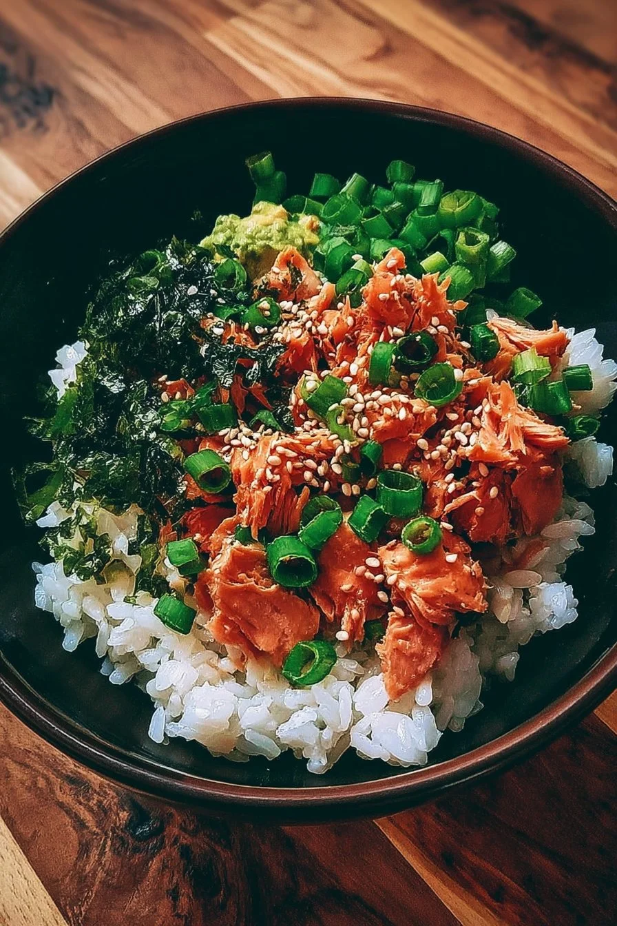 Spicy canned salmon rice bowl served in a vibrant dish with fresh vegetables