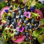 Delicious Blueberry Pistachio Spring Salad with fresh fruits and nuts