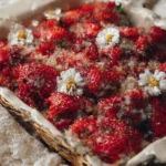 Delicious fresh strawberry cobbler topped with golden biscuit crust