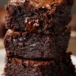 Delicious fudgy homemade brownies on a wooden table