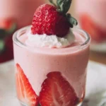 Delicious homemade strawberry mousse served in a glass with fresh strawberries